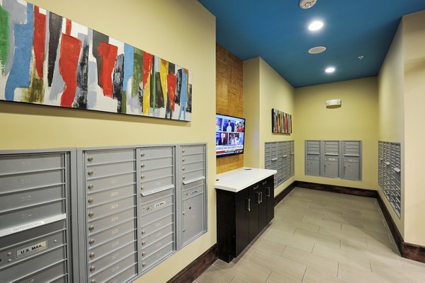 Modern mail room with secure parcel lockers at 422 at the Lake Apartments
