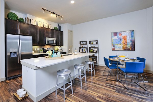 Dining room featuring elegant lighting and modern decor at 422 at the Lake Apartments