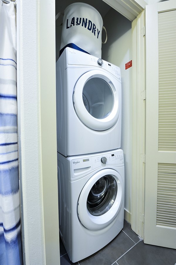 Modern laundry room with energy-efficient washers and dryers at 422 at the Lake Apartments, ideal for convenient living