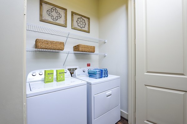 Laundry room equipped with modern appliances at 422 at the Lake Apartments