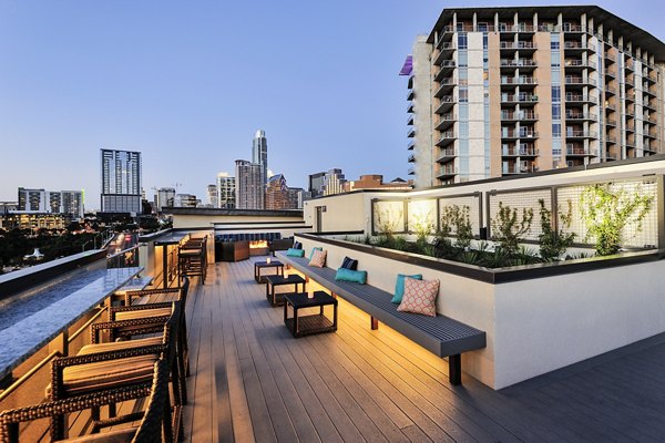 Cozy balcony with fire pit at 422 at the Lake Apartments