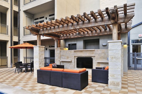 Cozy fire pit lounge area at 422 at the Lake Apartments, perfect for evening gatherings and relaxation
