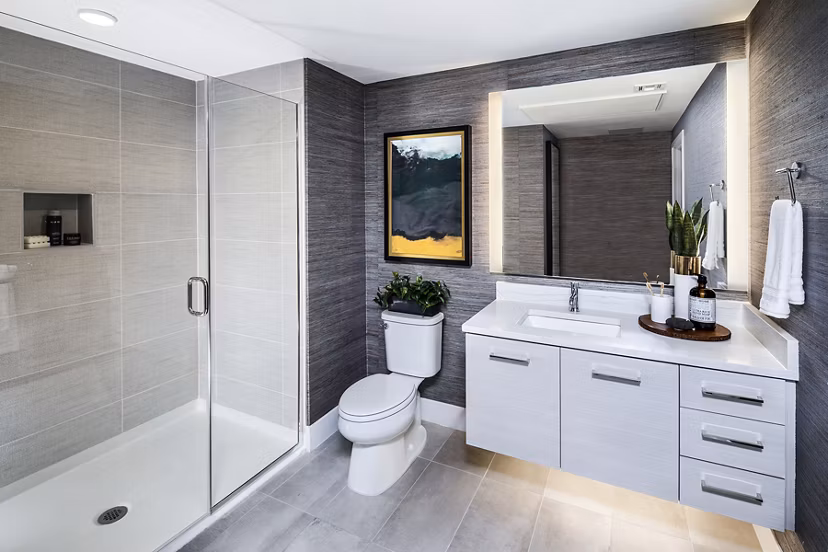 Modern bathroom with sleek fixtures at Savoy Apartments featuring luxury amenities and contemporary design