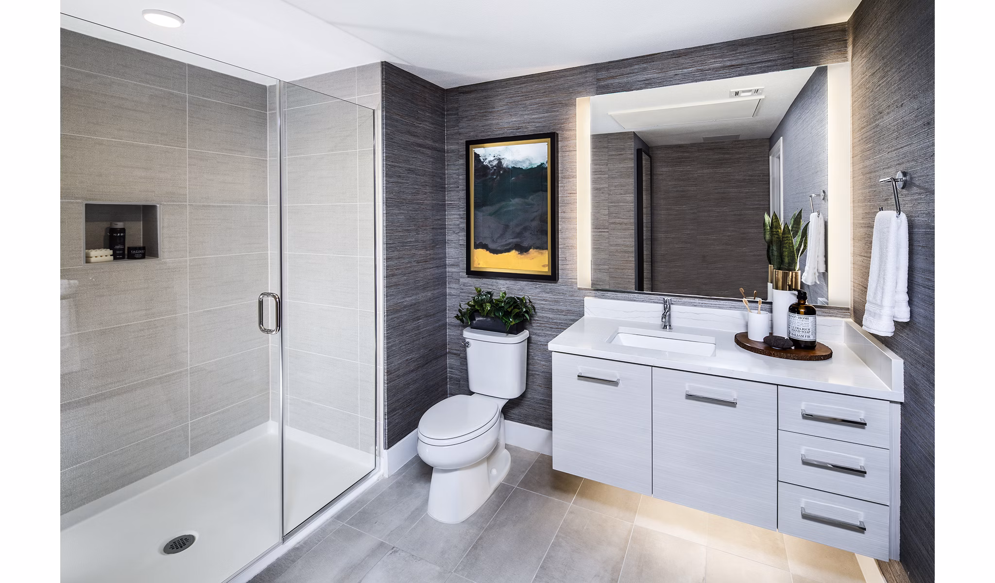 Modern bathroom with sleek fixtures at Savoy Apartments featuring luxury amenities and contemporary design