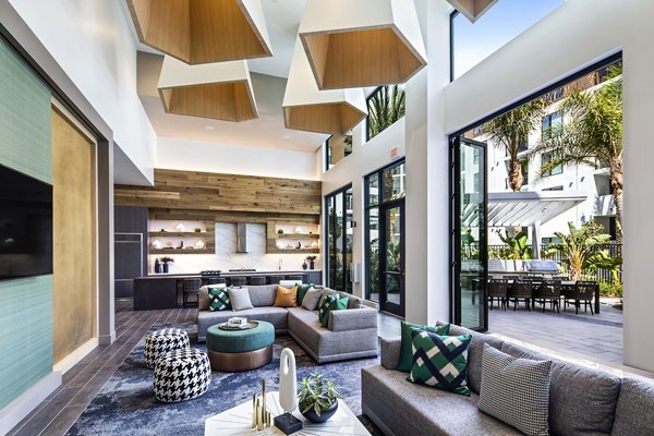 Savoy Apartments: Modern clubhouse featuring elegant lobby with comfortable seating and stylish decor in upscale community