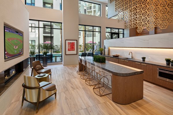 Modern clubhouse featuring elegant seating and entertainment options at Savoy Apartments