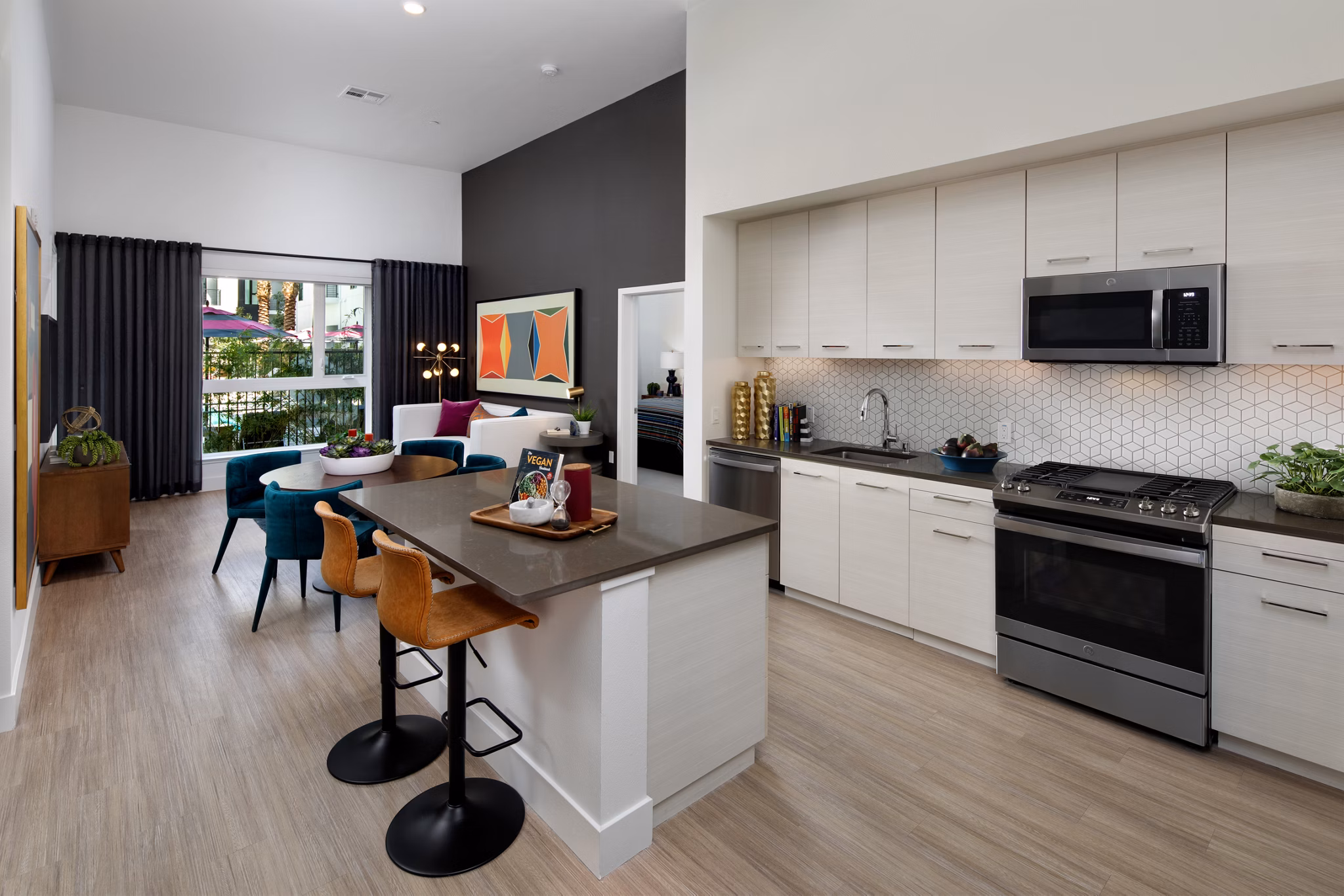 Contemporary kitchen with modern appliances at Savoy Apartments