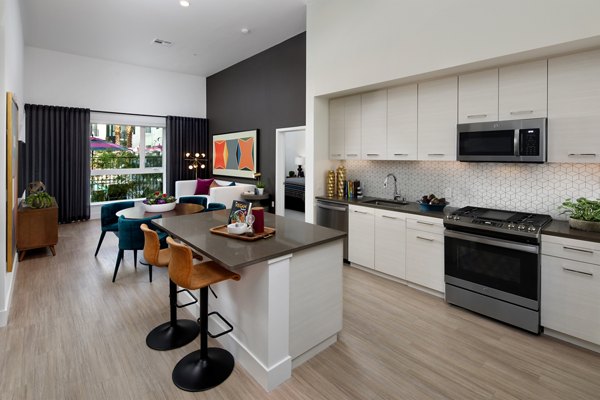 Contemporary kitchen with modern appliances at Savoy Apartments
