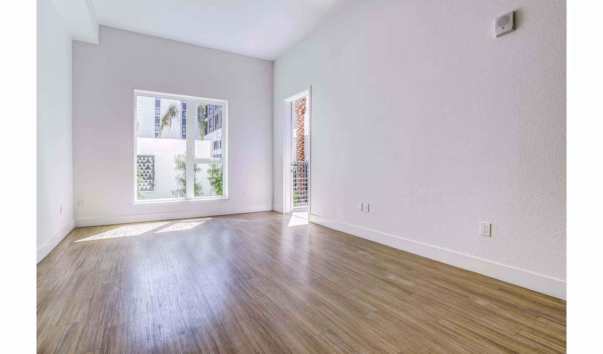 Savoy Apartments: Elegant living room with plush seating and modern decor in luxury Greystar community