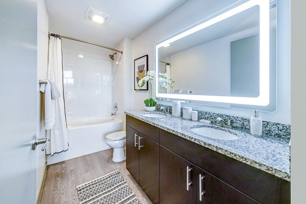 Bathroom featuring modern fixtures at Navette on the Bay Apartments