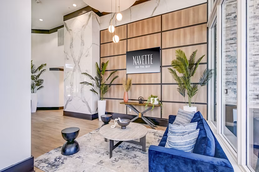 Modern clubhouse featuring game room and lounge at Navette on the Bay Apartments