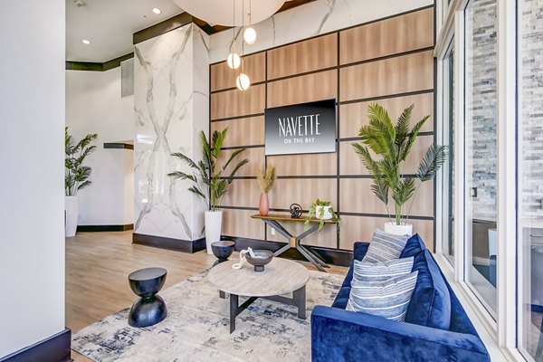 Modern clubhouse featuring game room and lounge at Navette on the Bay Apartments