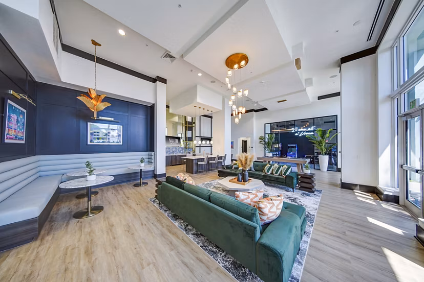 Clubhouse featuring modern design and lounge spaces at Navette on the Bay Apartments