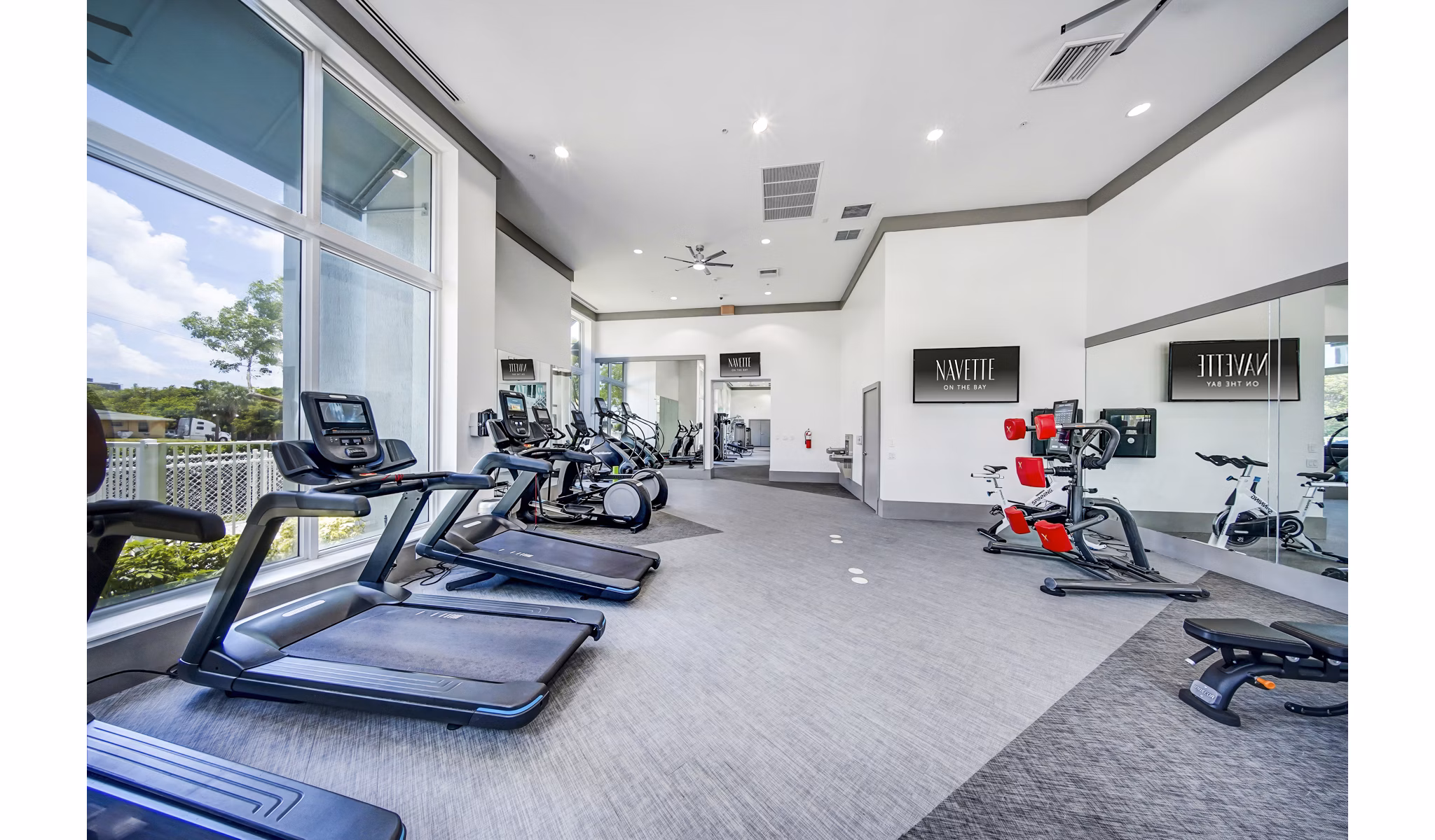 Fitness center with modern equipment at Navette on the Bay Apartments