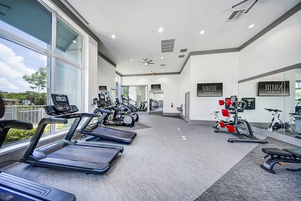 Fitness center with modern equipment at Navette on the Bay Apartments