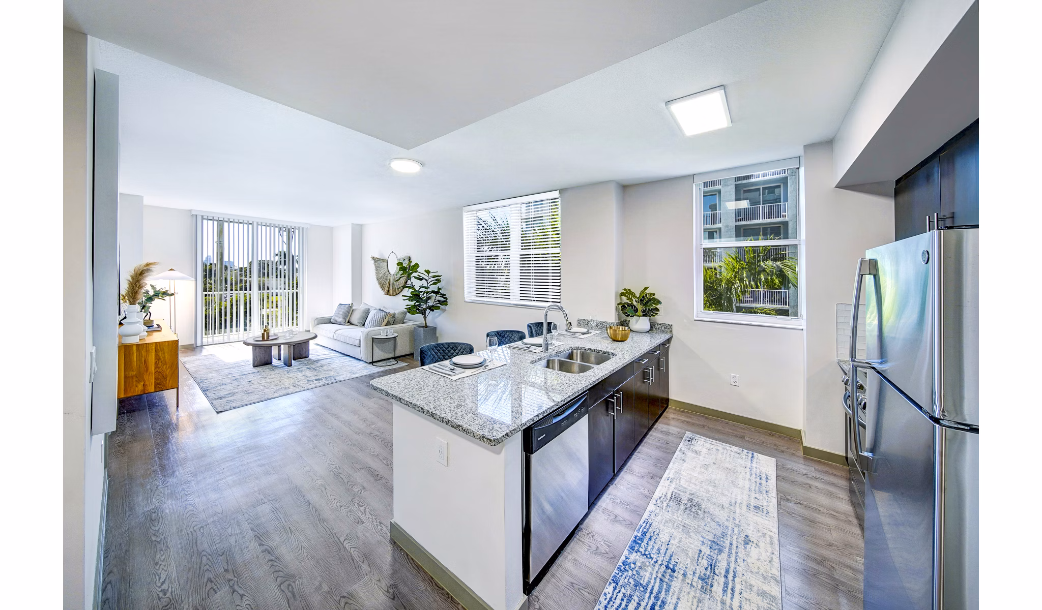 Kitchen featuring sleek countertops and stainless steel appliances at Navette on the Bay Apartments in luxury setting