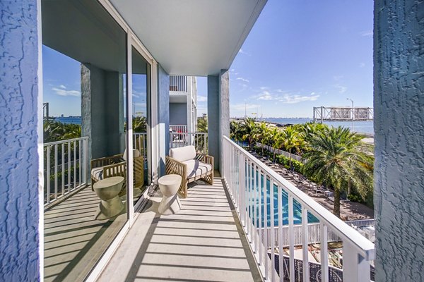 Scenic waterfront patio at Navette on the Bay Apartments with comfortable seating and bay views