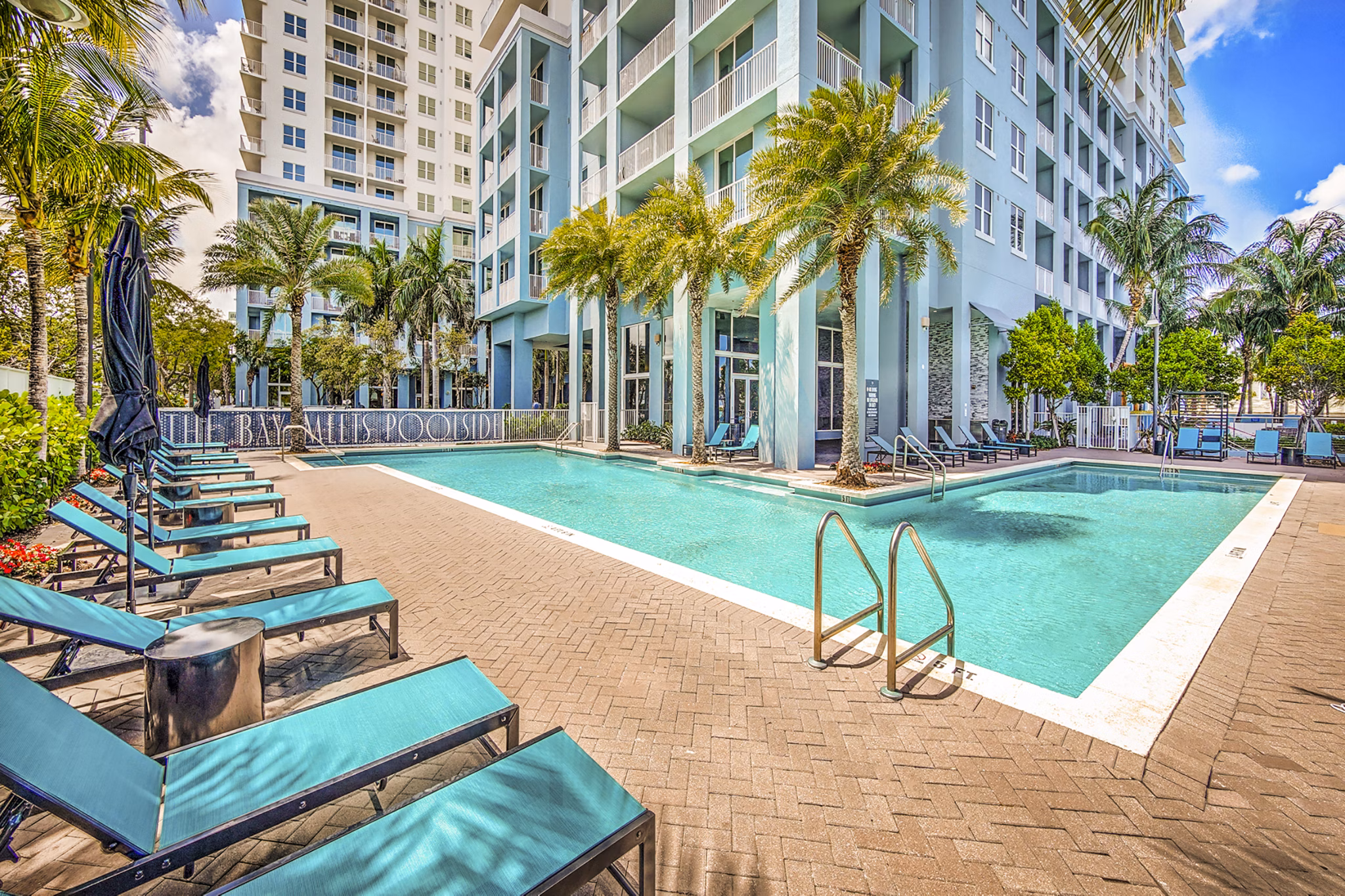 Luxurious pool overlooking waterfront at Navette on the Bay Apartments, ideal for relaxation and leisure