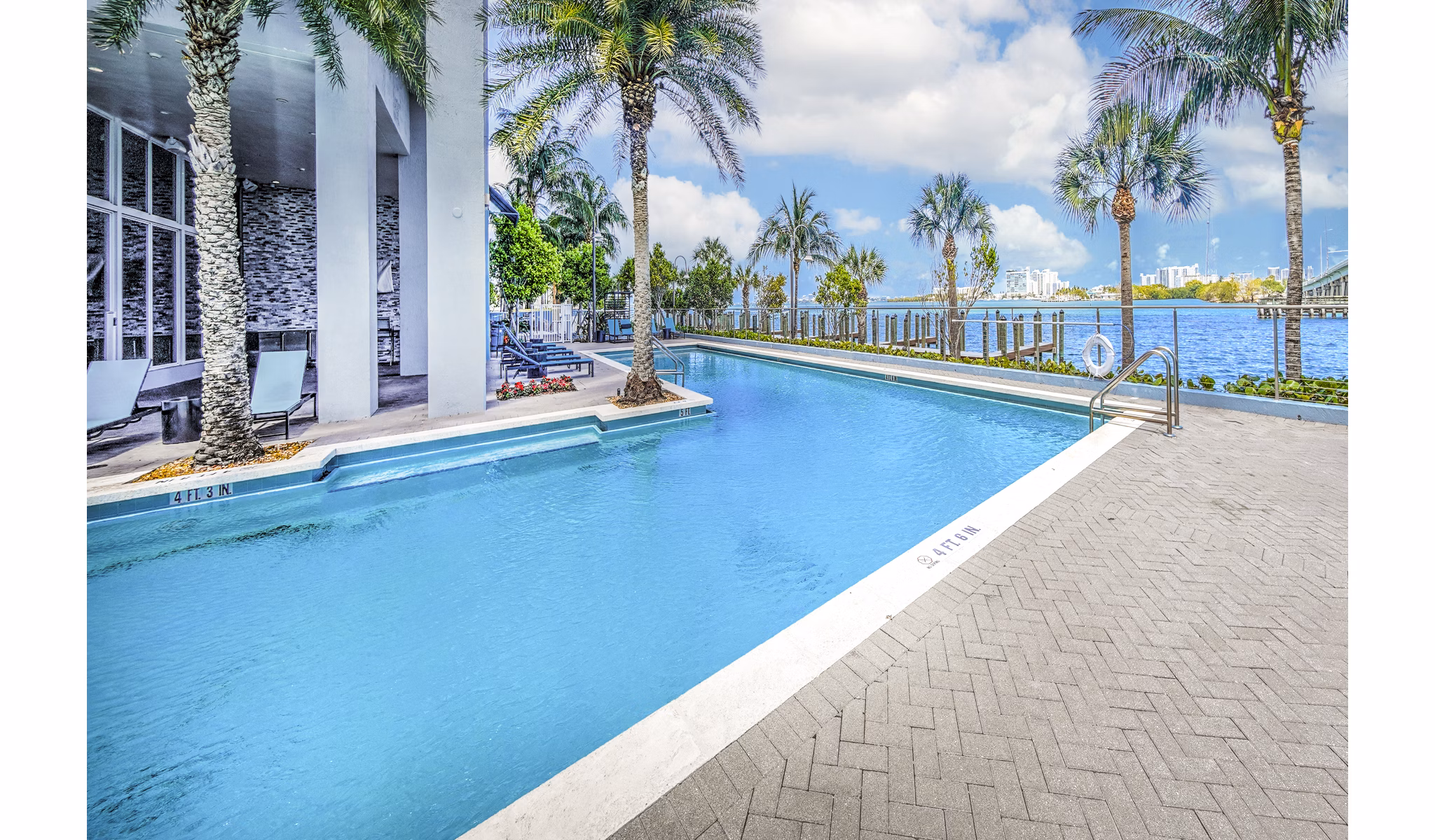 Luxury pool with stunning bay views at Navette on the Bay Apartments Enjoy relaxation and recreation in this premier waterfront community