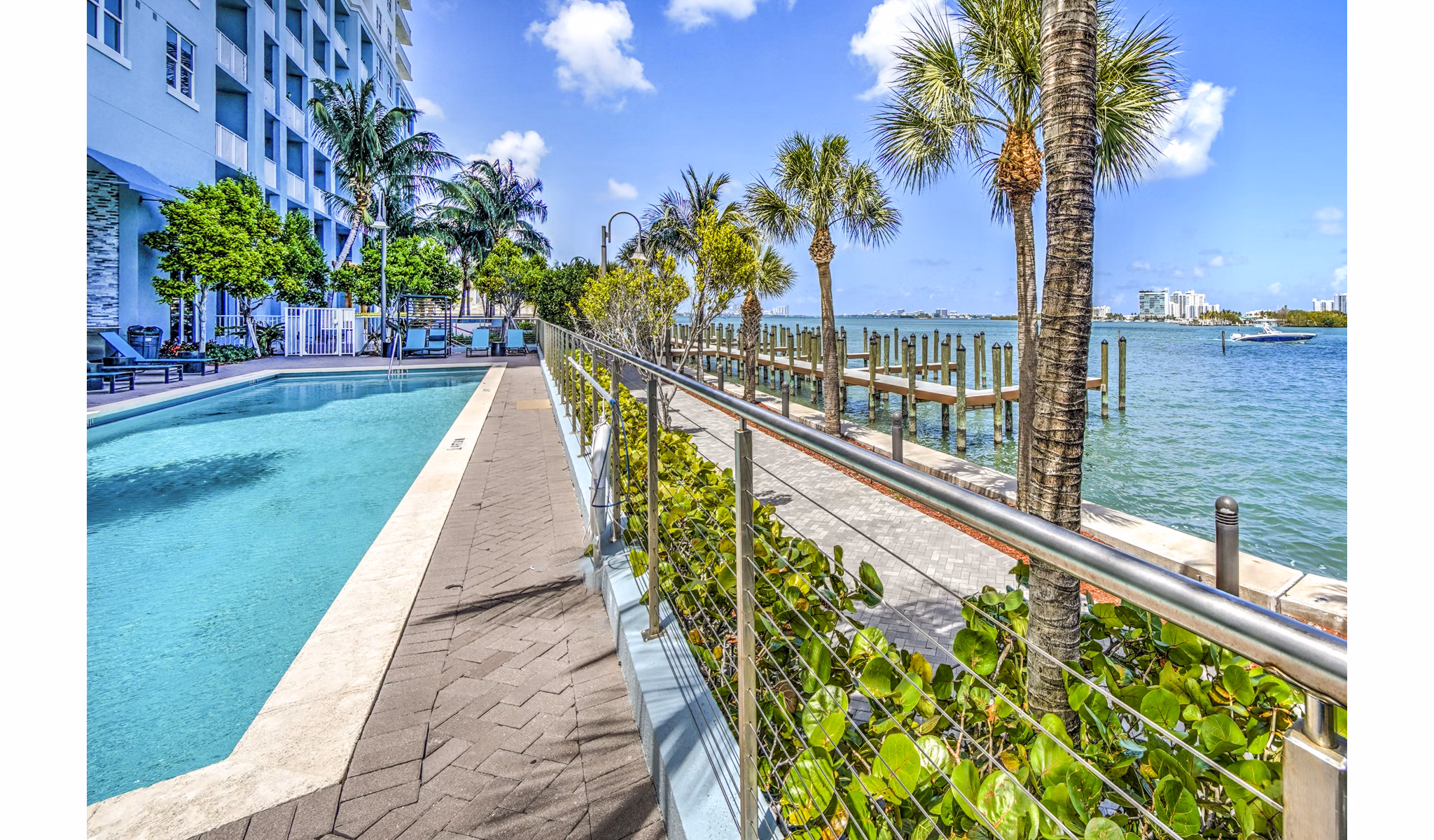 Luxurious pool at Navette on the Bay Apartments offering stunning waterfront views