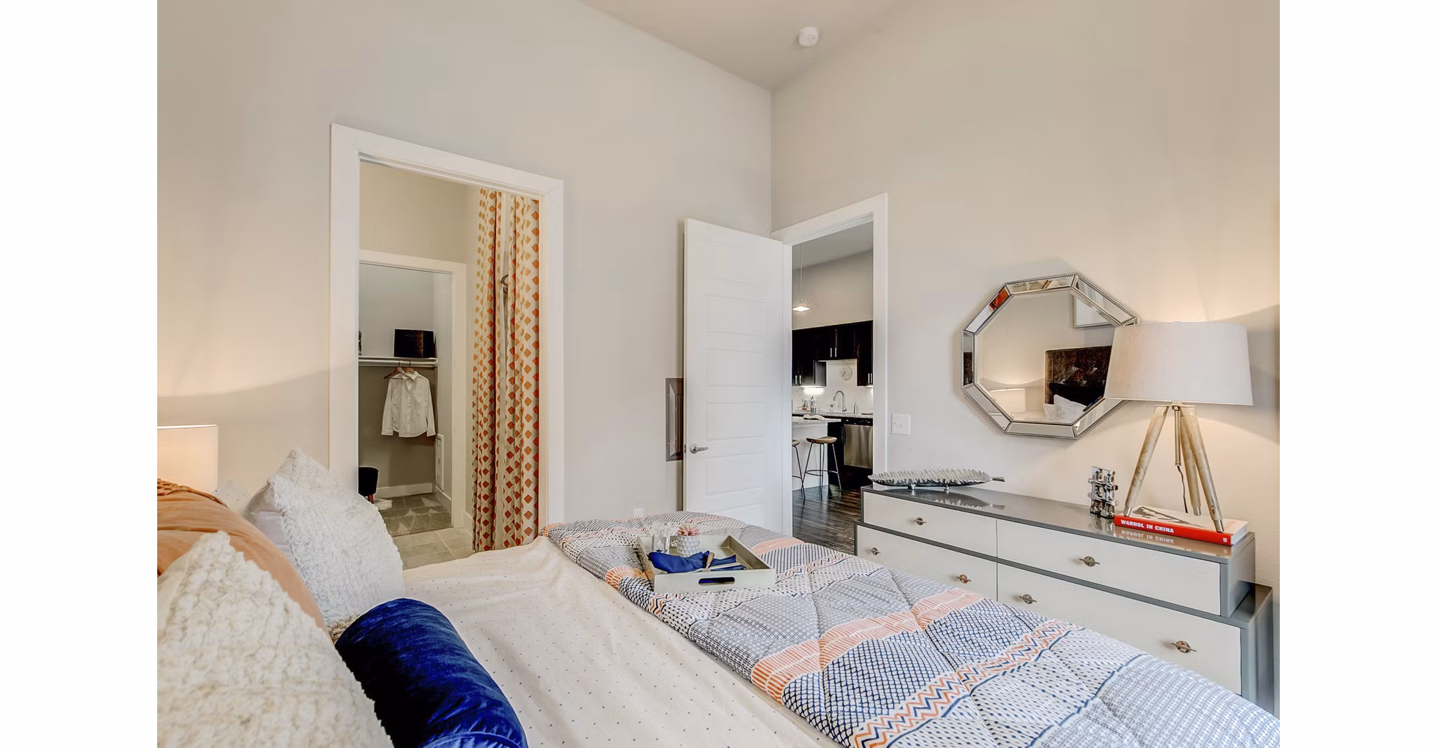 Modern bedroom with stunning river views at Eastbank Riverwalk Apartments