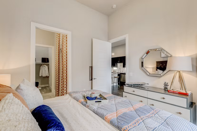 Modern bedroom with stunning river views at Eastbank Riverwalk Apartments