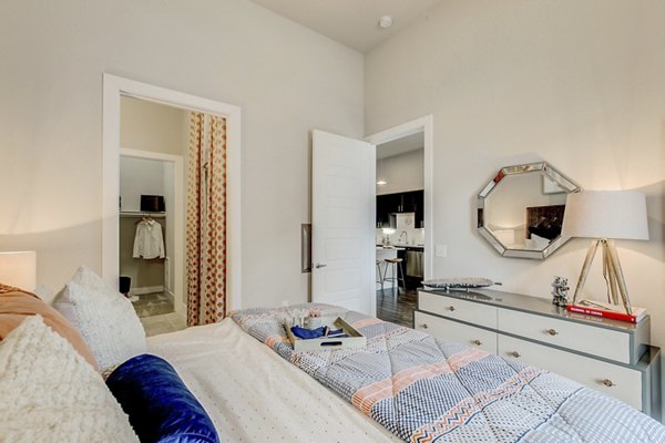 Modern bedroom with stunning river views at Eastbank Riverwalk Apartments