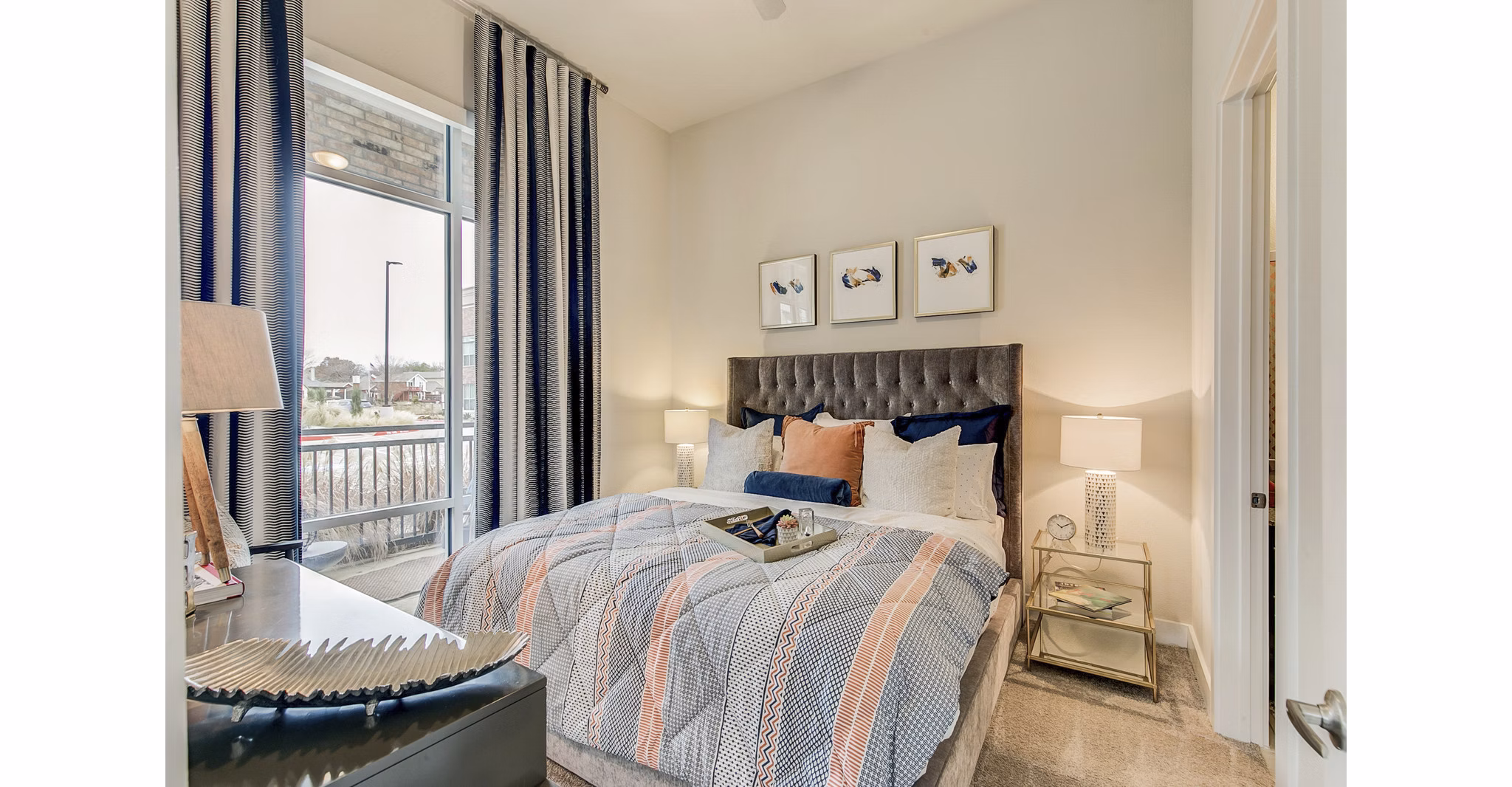 Cozy bedroom with river views at Eastbank Riverwalk Apartments, luxury living near downtown, ideal for comfort and relaxation