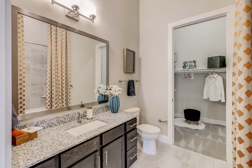 Modern bathroom with sleek fixtures at Eastbank Riverwalk Apartments, featuring elegant design and premium amenities in luxury living
