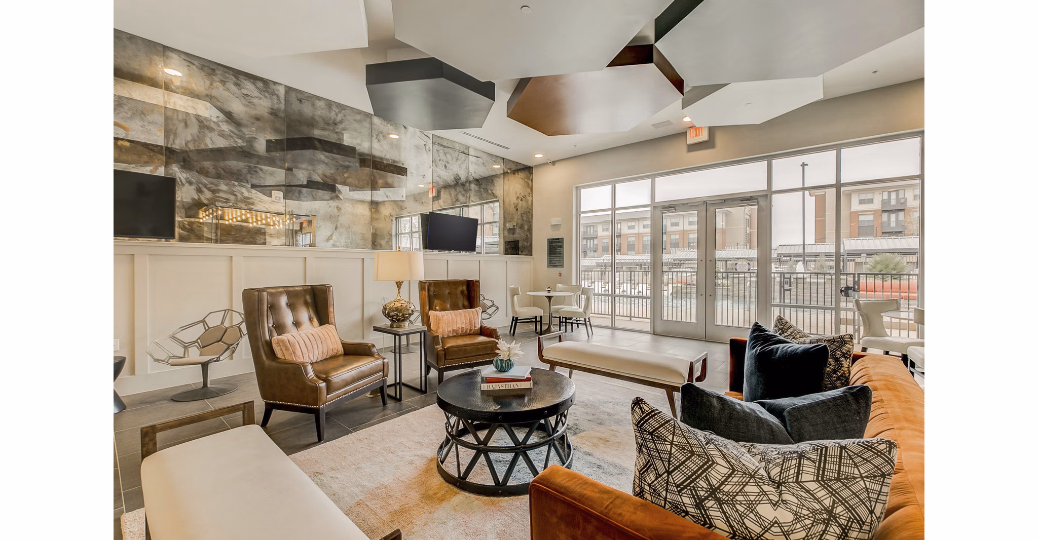 Modern clubhouse with spacious seating at Eastbank Riverwalk Apartments, offering luxury amenities and social spaces for residents