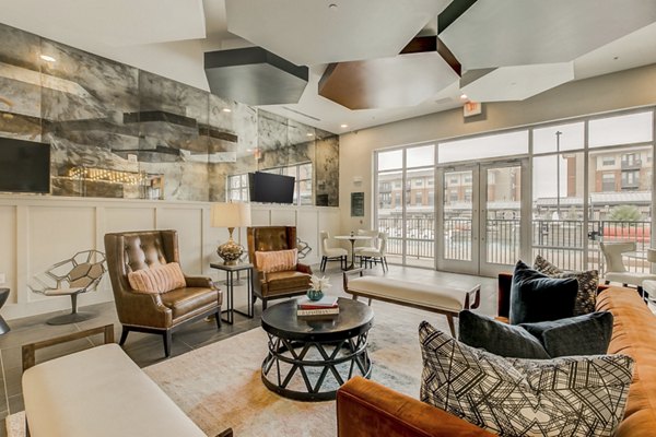 Modern clubhouse with spacious seating at Eastbank Riverwalk Apartments, offering luxury amenities and social spaces for residents