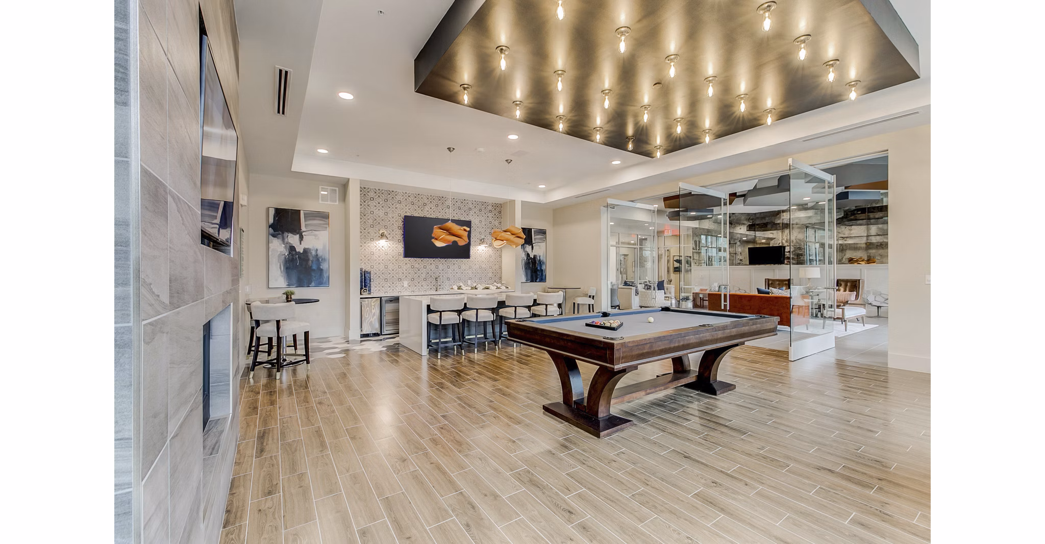 Game room with pool table and lounge seating at Eastbank Riverwalk Apartments, ideal for relaxation and entertainment