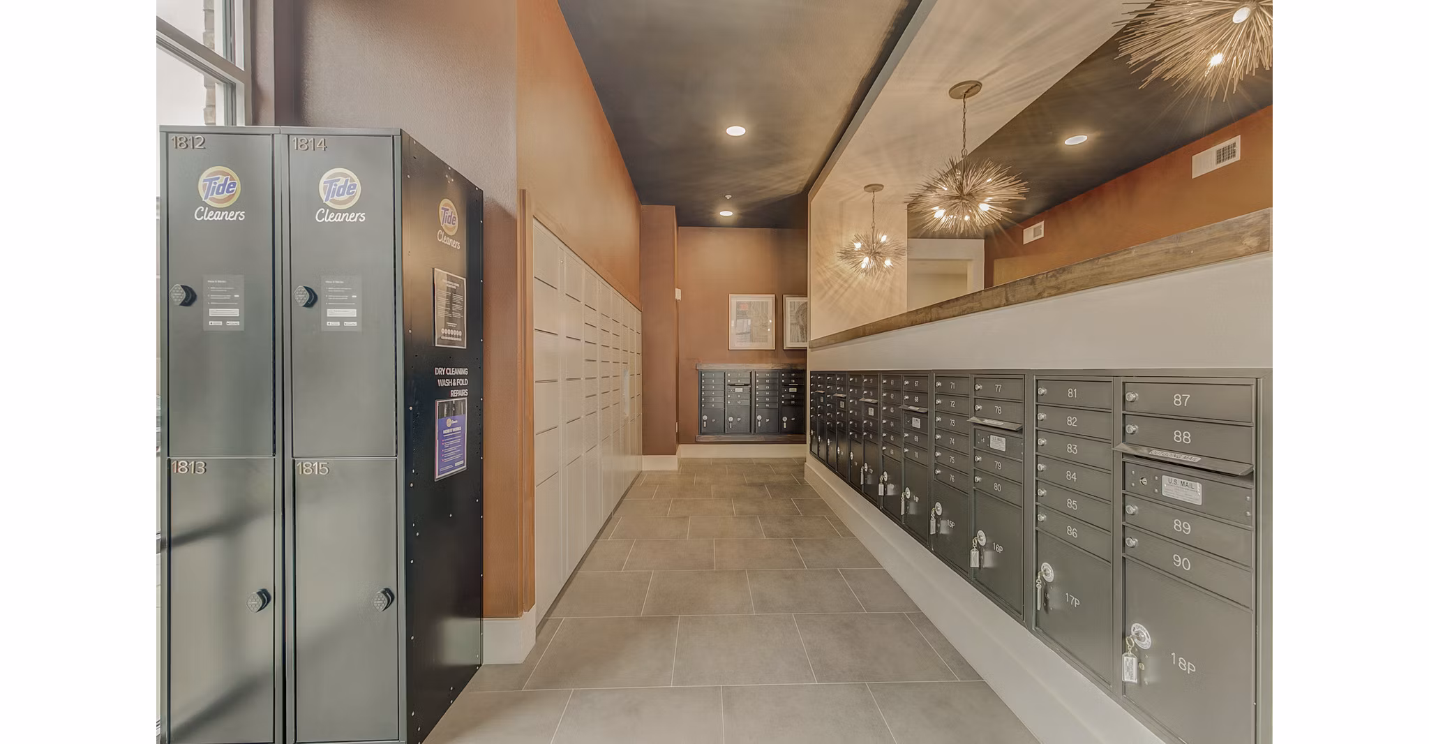 Modern mail room with secure package lockers at Eastbank Riverwalk Apartments