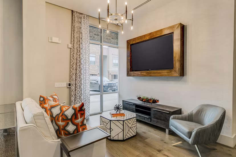 Elegant clubhouse at Eastbank Riverwalk Apartments boasting modern design and cozy seating, perfect for community gatherings or relaxation