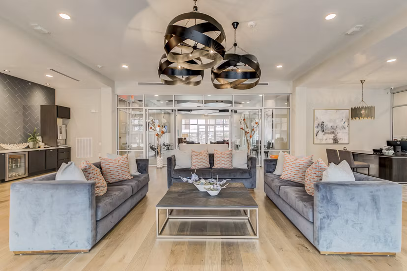 Clubhouse featuring modern design and social spaces at Eastbank Riverwalk Apartments