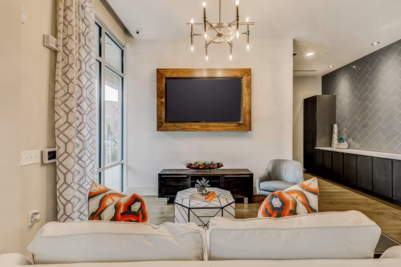 Clubhouse with modern decor and comfortable seating at Eastbank Riverwalk Apartments
