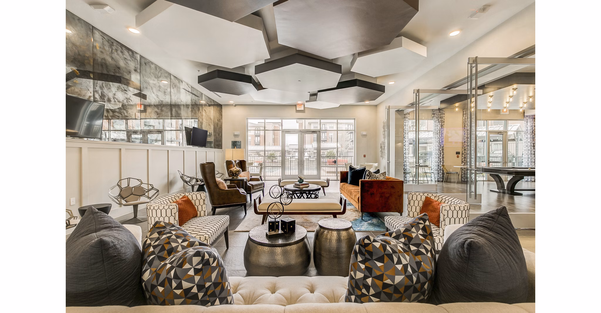 Clubhouse with modern seating and large windows at Eastbank Riverwalk Apartments, offering a stylish space for socializing and relaxing