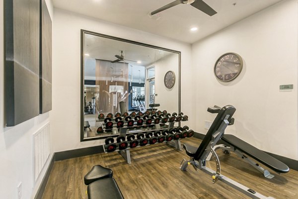 State-of-the-art fitness center at Eastbank Riverwalk Apartments offering modern exercise equipment and spacious workout areas