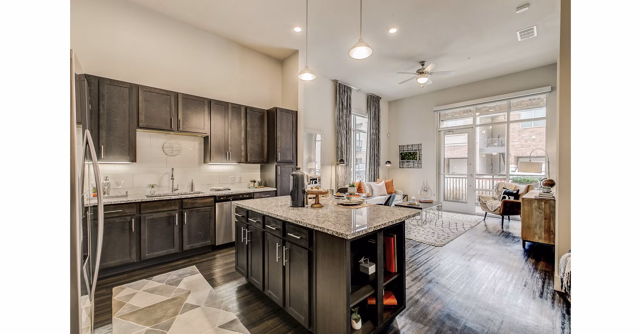 Modern kitchen with stainless steel appliances at Eastbank Riverwalk Apartments