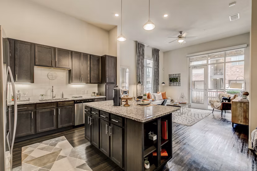 Modern kitchen with stainless steel appliances at Eastbank Riverwalk Apartments