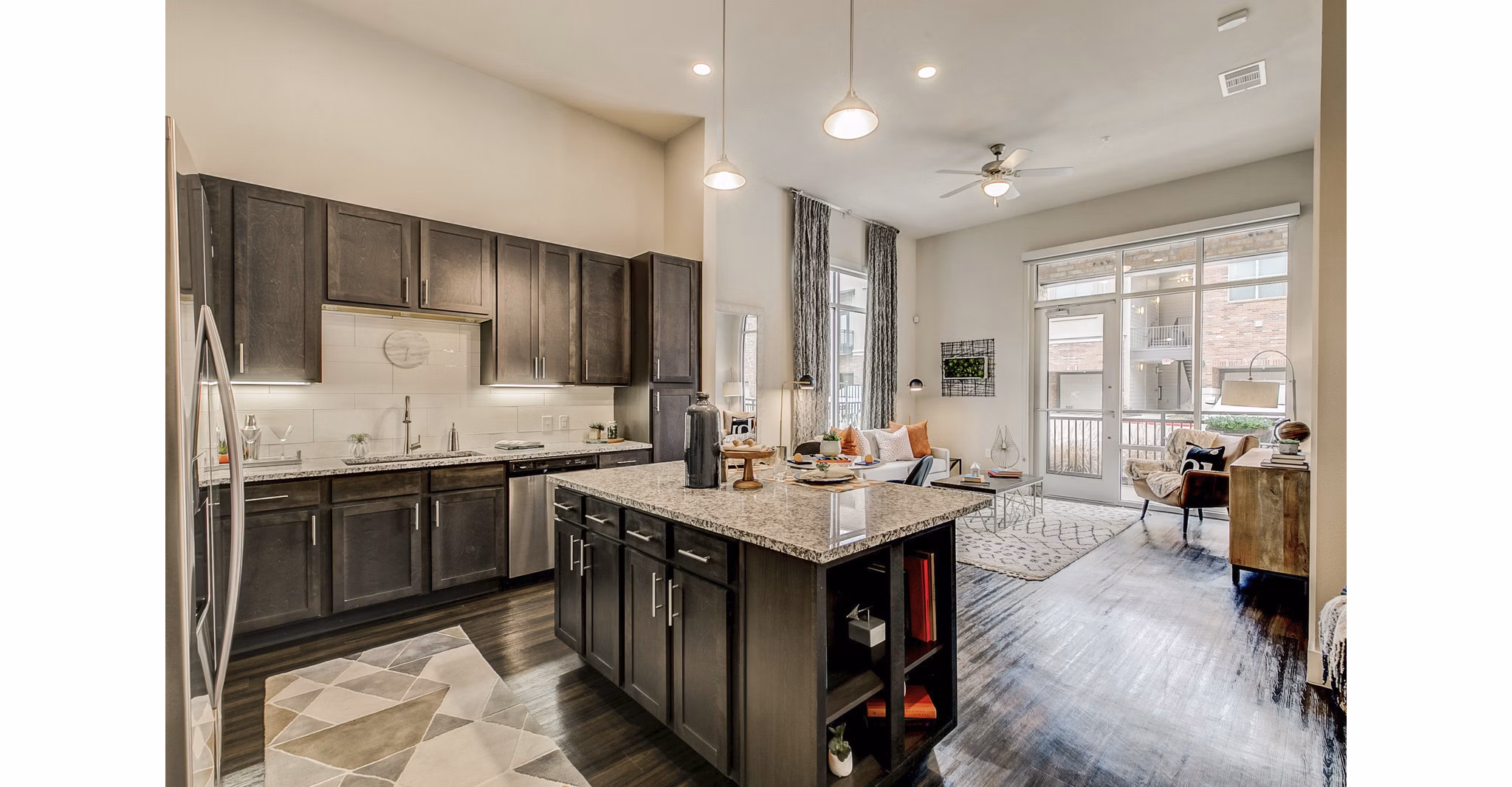 Modern kitchen with stainless steel appliances at Eastbank Riverwalk Apartments