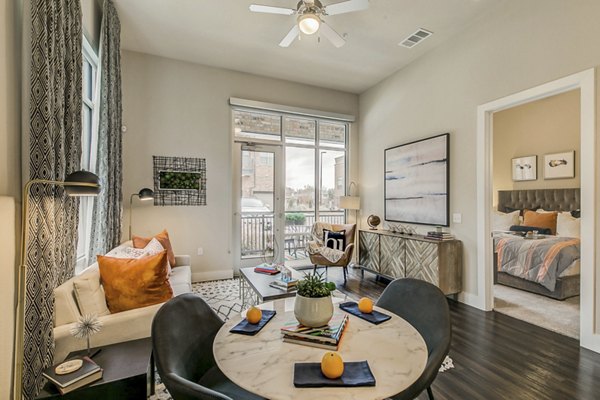 Spacious living room with modern decor at Eastbank Riverwalk Apartments