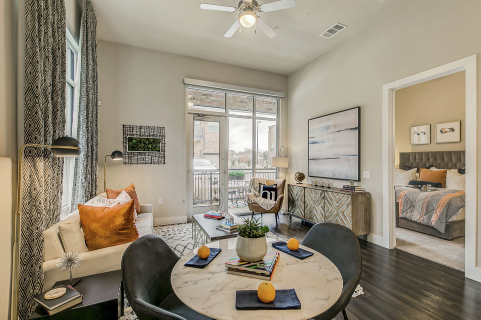 Spacious living room with modern decor at Eastbank Riverwalk Apartments