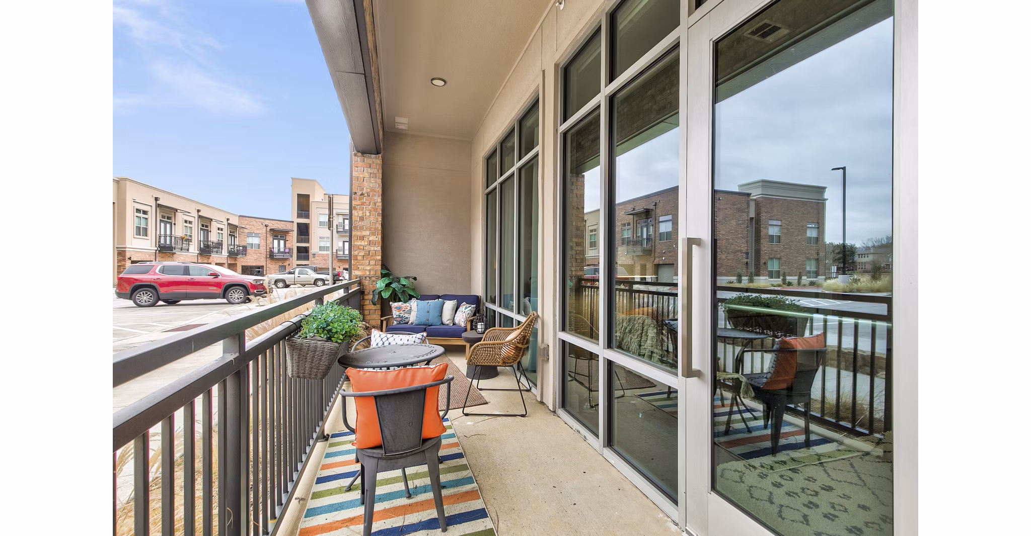 Riverside view from a stylish patio at Eastbank Riverwalk Apartments