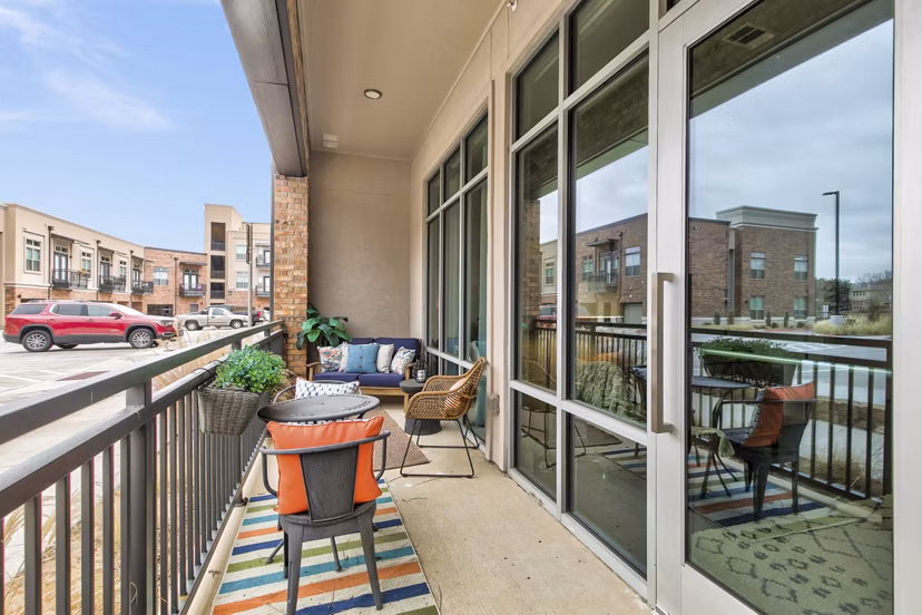 Riverside view from a stylish patio at Eastbank Riverwalk Apartments