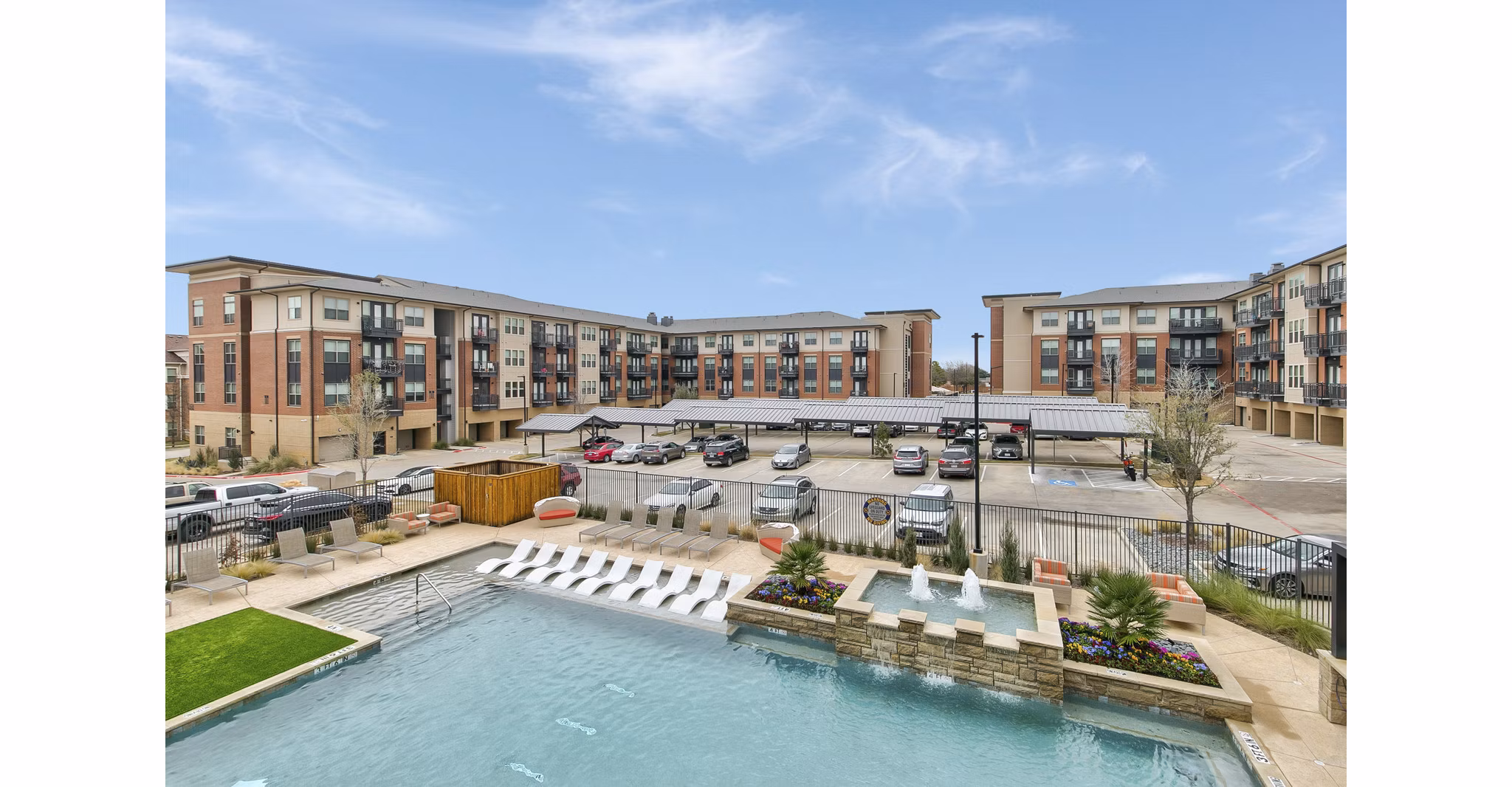 Rooftop pool with lounging area at Eastbank Riverwalk Apartments offering luxury amenities for relaxation and entertainment