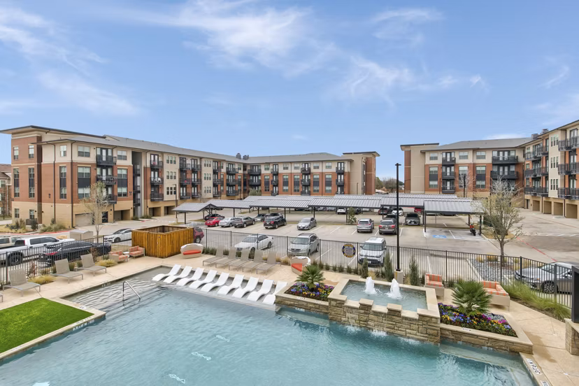 Rooftop pool with lounging area at Eastbank Riverwalk Apartments offering luxury amenities for relaxation and entertainment