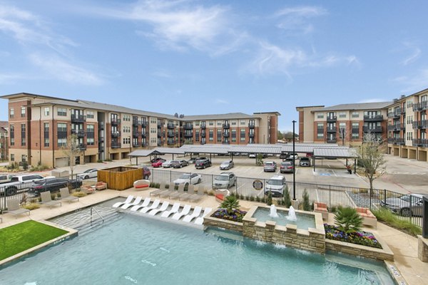 Rooftop pool with lounging area at Eastbank Riverwalk Apartments offering luxury amenities for relaxation and entertainment