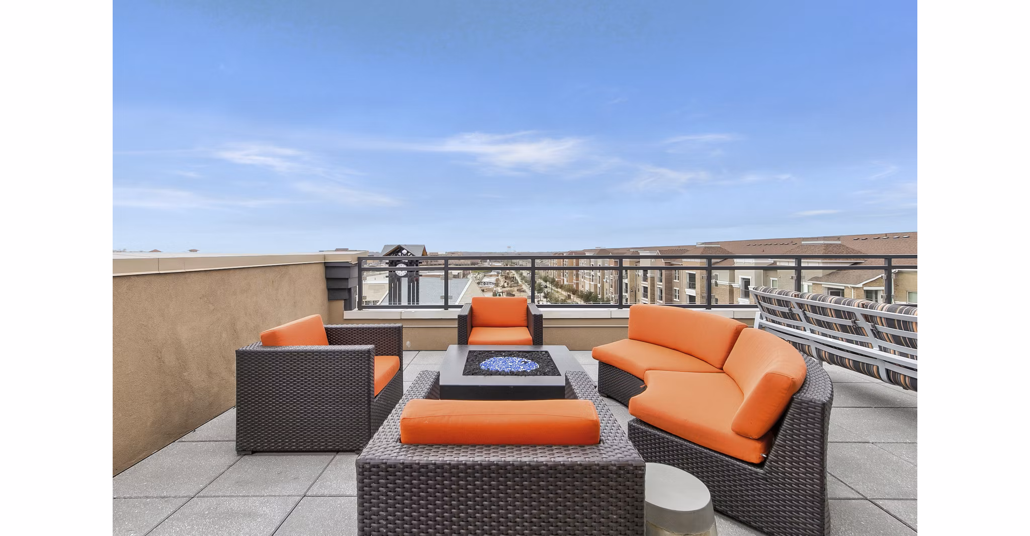 Fire pit with cozy seating at Eastbank Riverwalk Apartments, offering relaxing outdoor leisure options for residents
