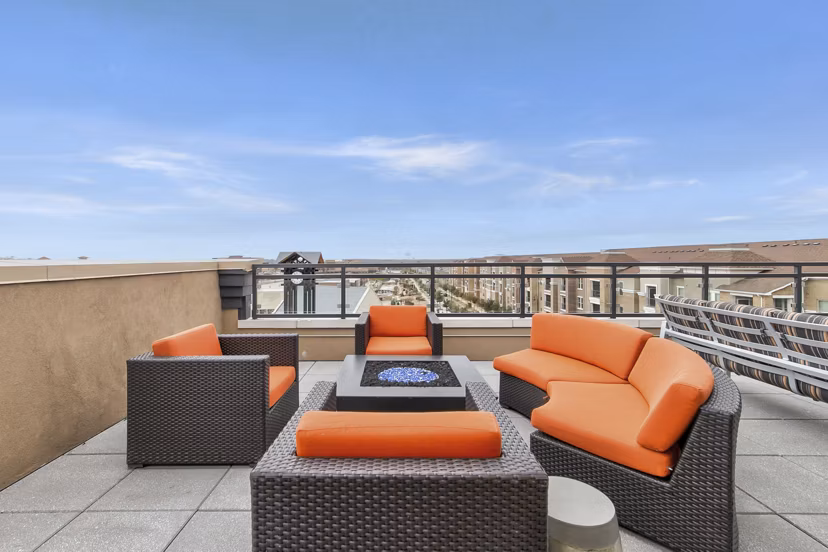 Fire pit with cozy seating at Eastbank Riverwalk Apartments, offering relaxing outdoor leisure options for residents